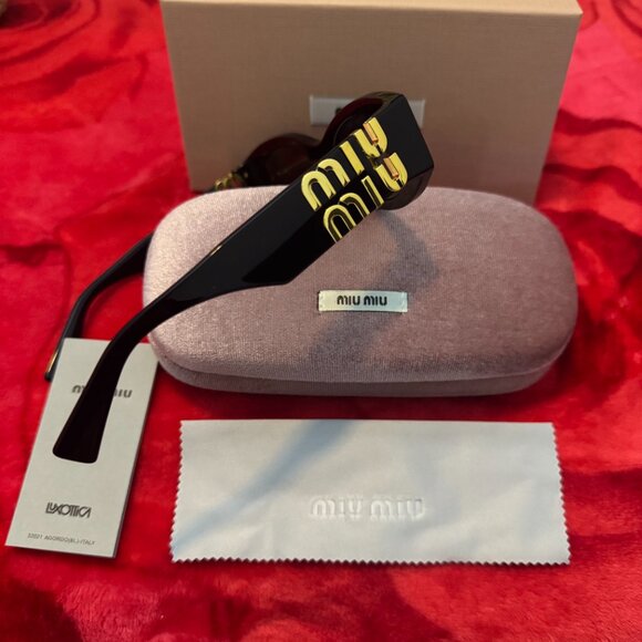 Miu Miu Black Sunglasses with Gold Logo – Chic Statement Vibes